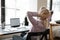 Office employee resting on chair, enjoying work break