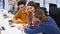 Office employees sit and discuss on start-up project in conference room with charts. Team of business partners