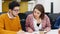 Office employees sit and discuss on start-up project in conference room with charts. Team of business partners