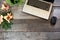 Office female wooden desk table with laptop and flower. Top view with copy space.