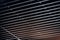 Office grille ceiling. Modern black metal grille ceiling, suspended covering. Abstract design texture