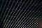 Office grille ceiling. Modern black metal grille ceiling, suspended covering. Abstract design texture