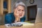 Office lifestyle portrait of sad and depressed middle aged attractive Asian woman working on laptop computer desk stressed and