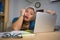 Office lifestyle portrait of sad and depressed middle aged attractive Asian woman working on laptop computer desk stressed and