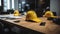 Office meeting with construction team, Yellow safety helmet on the workplace desk