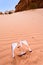 Office note book in red sand of desert