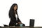 Office portrait of young happy and attractive black afro American businesswoman sitting elegant on desk smiling relaxed in busines