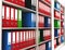 Office ring binders on a bookshelf