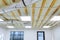 Office room frame hung ceiling at construction of metal rails of a modern built-in lamp ceiling