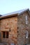 The Office - sandstone house with side door and windows