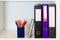 Office shelf with folders and pencil holder