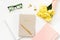 Office supplies for women`s work: notebooks, pen, paper clips, yellow tulips and glasses. Hipster`s stylish flat lay