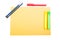 Office supplies on yellow notepad on organized desktop