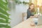 Office table with Asian woman in smiling face with coffee cup an