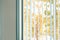 Office window blinds curtain with nature autumn color view and sunlight in the evening, relax workplace