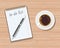 Office wooden desk. Coffee and blank memo with pen