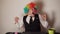 Office worker in clown wig, clown concept at work.