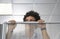 Office Worker Peering Over Cubicle Wall