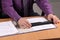 Office worker scans a document with a hand scanner