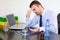 Office worker taking pills against stress