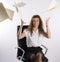 Office worker throws paperwork into the air