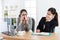 Office worker woman sneezing during conference