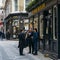 Office workers enjoy a pint at lunchtime at the Ye Olde Watling pub in the City of London, England, UK