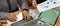 Office workers working with business chart, laptop and mock up tablet on meeting table