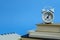 Office workload concept - stack of book with clock on the top