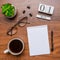 Office workplace with coffee cup, eyeglasses, stationery and plant. Date 01 March on wooden block calendar. White blank empty