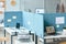 Office workplace with partition walls in blue