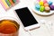 Office workspace with keyboard notepad coffee of cup and smartphone on wood table