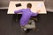 Office yoga - business man exercising at desk