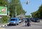 The officer checks police motorcyclist on a city street.