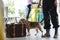 Officer with dog checking suitcase in airport. Luggage inspection