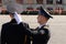 An officer of the presidential regiment adjusts the cap of a soldier during the dress rehearsal of a military parade on Red Square
