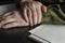 Officer`s hands, document folder on black desk in close-up