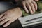 Officer`s hands, document folder on black desk in close-up