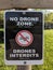 Official bilingual NO DRONE ZONE sign warning with crossed drone icon