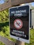 Official bilingual NO DRONE ZONE sign warning with crossed drone icon
