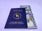 Official blue Passport of Bangladesh with 100 US dollar on white background