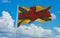 official flag of Anglo Lithuanian lithuania at cloudy sky background on sunset, panoramic view. lithuanian travel and patriot