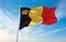 official flag of Belgium with crown , Belgium at cloudy sky background on sunset, panoramic view. Belgian travel and patriot