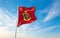 official flag of Royal Standard of Queen Paola , Belgium at cloudy sky background on sunset, panoramic view. Belgian travel and