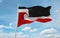 official flag of Tino Rangatiratanga Maori sovereignty movement New Zealand at cloudy sky background on sunset, panoramic view.