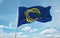 official flag of Tokelau local New Zealand at cloudy sky background on sunset, panoramic view. New Zealand travel and patriot