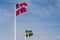 The official flags of Denmark and Sweden