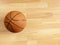 An official orange ball on a basketball court