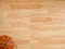 An official orange ball on a basketball court