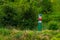 Official warning pole about the border zone of the Republic of Moldova with the state emblem on the plate. Background